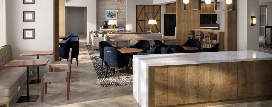 Rendering of the hotel lobby with seating and a bar