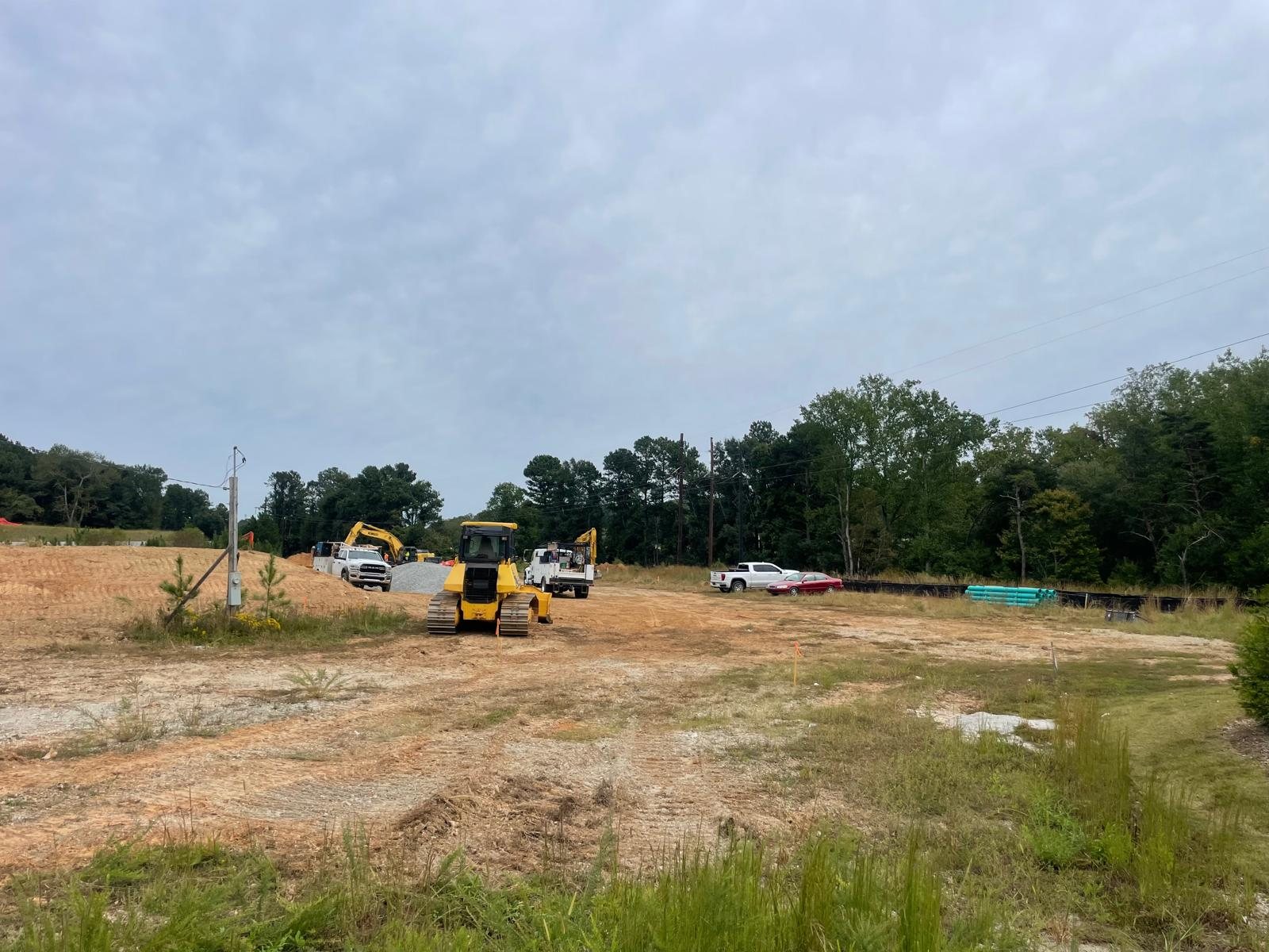 Earth-moving equipment on the cleared hotel site
